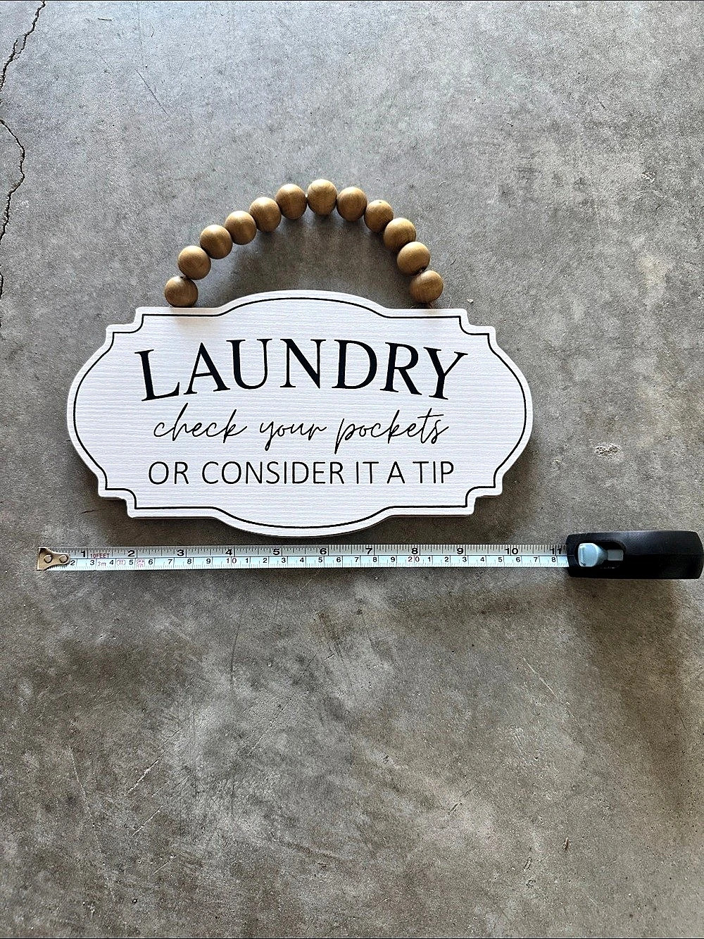 Hobby Lobby Laundry Check Your Pockets Or Consider It A Tip sign White & Brown